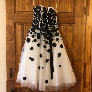Black and white knee length dress.